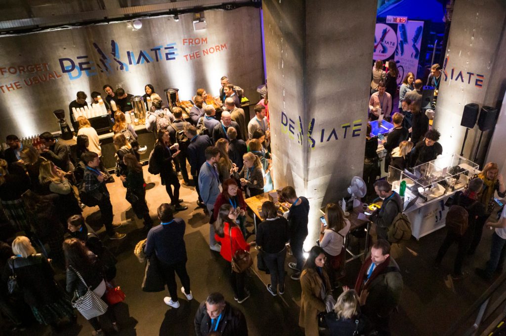 Delegates networking outside plenary space at Deviate Innovation Summit 2019