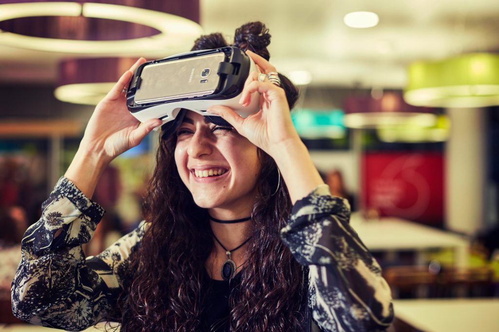 Smiling woman after virtual reality presentation at Vodafone Digital Telco