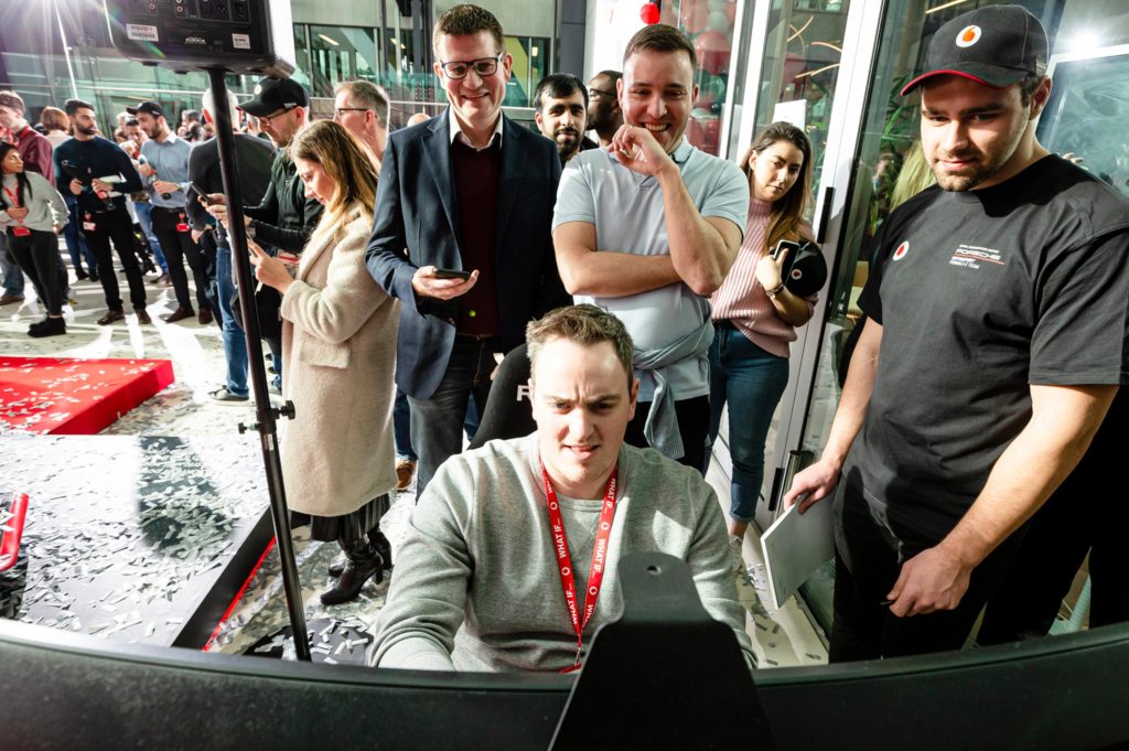 Guests try brand simulation at Vodafone and Porsche Formular E brand launch event 